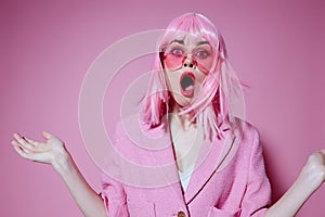 Positive young woman bright makeup pink hair glamor stylish glasses color background unaltered