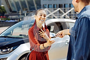 Positive young woman looking at her boyfriend