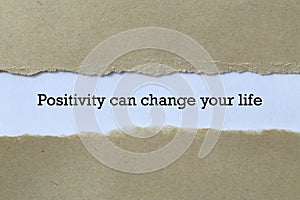 positivity can change your life on white paper