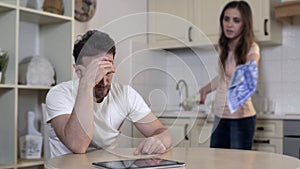 Possessive wife fighting with husband at home, accusing him of cheating, divorce