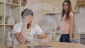 Possessive wife fighting with husband at home, accusing him of cheating, divorce