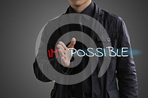 Possibility concept. Businessman makes the impossible possible