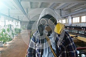 Post-apocalyptic.The guy in the gas mask stands in an abandoned building