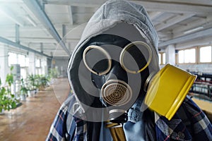 Post-apocalyptic.The guy in the gas mask stands in an abandoned building