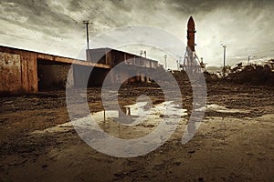 post Apocalyptic Nasa launch pad with old rusted Artamis 1 rock 80mm Lens abandoned cars overgrown puddles on asphalt apocalyptic