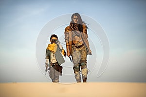 Post Apocalyptic Woman and Boy Outdoors in the Wasteland