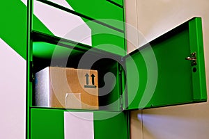 Post automat terminal and a parcel in it. Mail delivery packstation concept