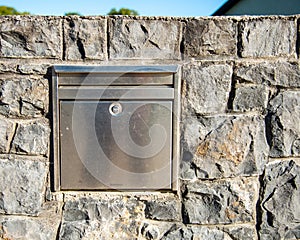 post box, embedded in a stone wall