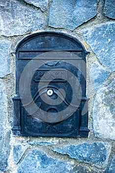 post box, embedded in a stone wall