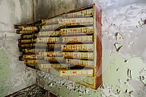 Post mail boxes in abandoned building in ghost town Pripyat Chornobyl Zone