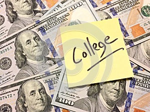 Post it note with hardwritten text college on money photo