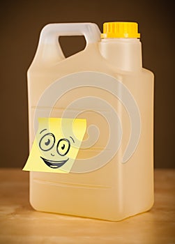 Post-it note with smiley face sticked on gallon