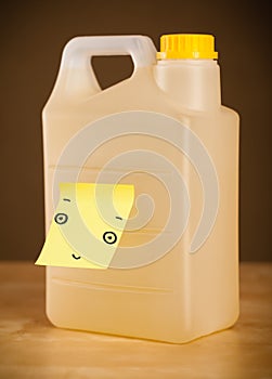 Post-it note with smiley face sticked on a gallon