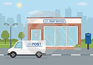 Post office building, delivery truck and mailbox on city background.