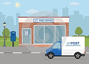 Post office building, delivery truck and mailbox on city background.