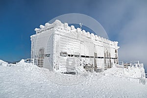 Post office called Postovna on top of Snezka covered with frost. The peak of the Snezka Mountain in winter in the