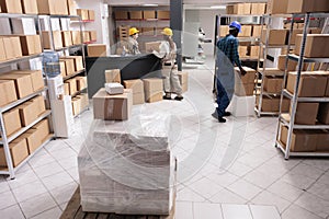 Post office storage workers managing parcels delivery