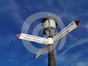 Post sign in Sitges, Catalan coastal holiday direction town