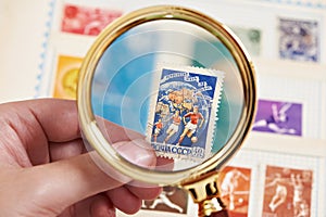 Postage sport stamp with football players on album