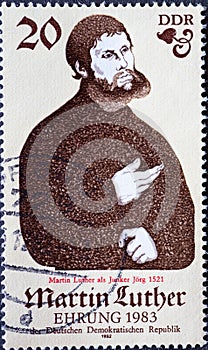A postage stamp from Germany, GDR showing a portrait of Martin Luther as Junker JÃÂ¶rg the pseudonym on