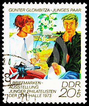 Postage stamp printed in Germany, Democratic Republic, shows Young pair, Stamps Exhibition of Young Philatelists serie, circa 1973