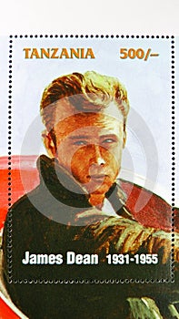 Postage stamp printed in Tanzania shows James Dean in a car, James Dean serie, circa 1996