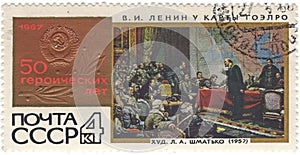 Postage stamp printed in the USSR shows picture `V.I. Lenin near map GOELRO` by artist L.A. Shmatko 1957