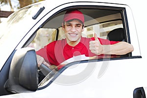 Postal delivery courier in a van