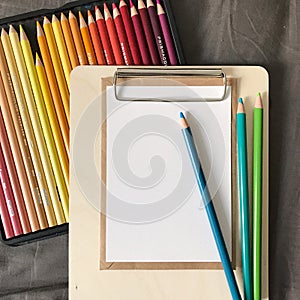 Postcard with Envelope and Pencils on Clipboard