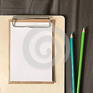 Postcard with Envelope and Pencils on Clipboard