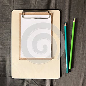 Postcard with Envelope and Pencils on Clipboard