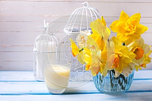 Postcard with fresh narcissus and candles