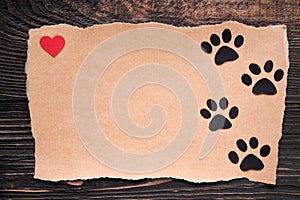 Postcard with paw foot trail icon and red heart, paper art style. Animal love concept, greeting card, invitation mockup