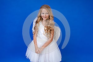 Postcard for valentine& x27;s day. Child in long white dress and with angel wings