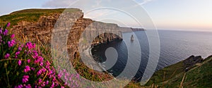 Postcard view of the Cliffs of Moher by sunset