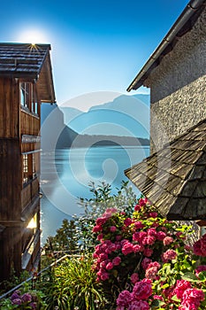 Postcard view of famous Hallstatt lakeside town,Austria. Scenic panoramic view of beautiful houses,blooming flowers,Hallstatter