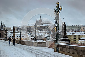 Postcard view of Prague Castle from Charles Bridge, Czech republic.Famous tourist destination.Prague winter panorama.Snowy day in