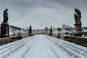 Postcard view of Prague Castle from Charles Bridge, Czech republic.Famous tourist destination.Prague winter panorama.Snowy day in