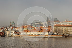 Postcard view of Prague Castle in mist from Charles Bridge,Czech republic.Famous tourist destination.Prague panorama photo
