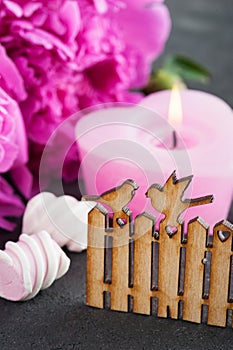 Postcard with wooden gate and birds, peony flowers, candle