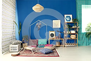 Postcolonial interior with colorful pillows