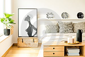 Poster in cozy bedroom interior