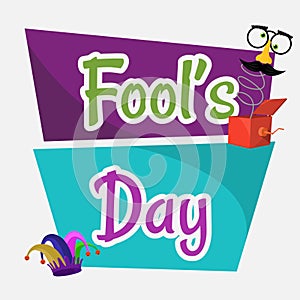 A poster of Fools Day with a jesters hat.