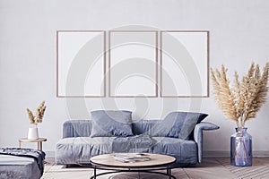 Poster frame mock up in living room interior with blue sofa and pa,pas grass