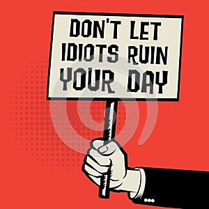 Poster in hand, text Don`t Let Idiots Ruin Your Day