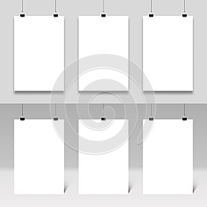 Poster mockup hanging on paperclips. Realistic posters frames template vector set. White paper boards with binders