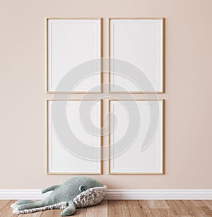 Poster mockup in minimal nursery design, wooden frames on beige interior background