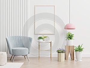 Poster mockup with two vertical frames on empty white wall in living room interior with blue velvet armchair