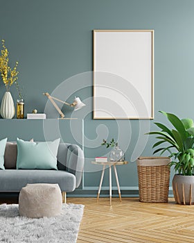 Poster mockup with vertical frames on empty dark green wall in living room interior with dark blue velvet sofa