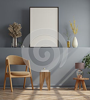 Poster mockup with vertical frames on empty dark wall in living room interior with velvet armchair